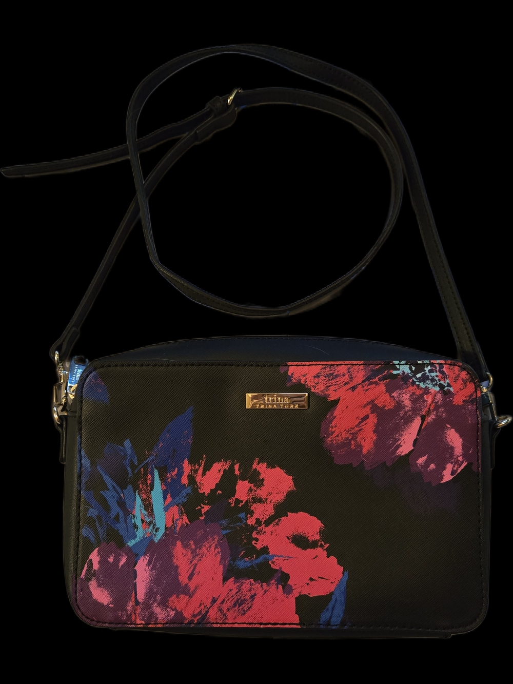 A stylish Trina Turk handbag featuring a vibrant floral print. 6x9.5x2.5.